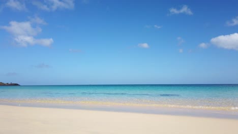 Crystal-clear-waters-of-a-beach-crashing-along-the-shoreline