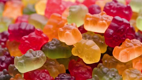 full frame looped spinning background of colorful jelly bear candies