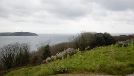 Looking-out-to-sea-with-St-Anthony-Head,-Lighthouse-in-background-from-Pendennis-head