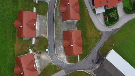 drone aerial bird eye view of a small village with cluster of houses