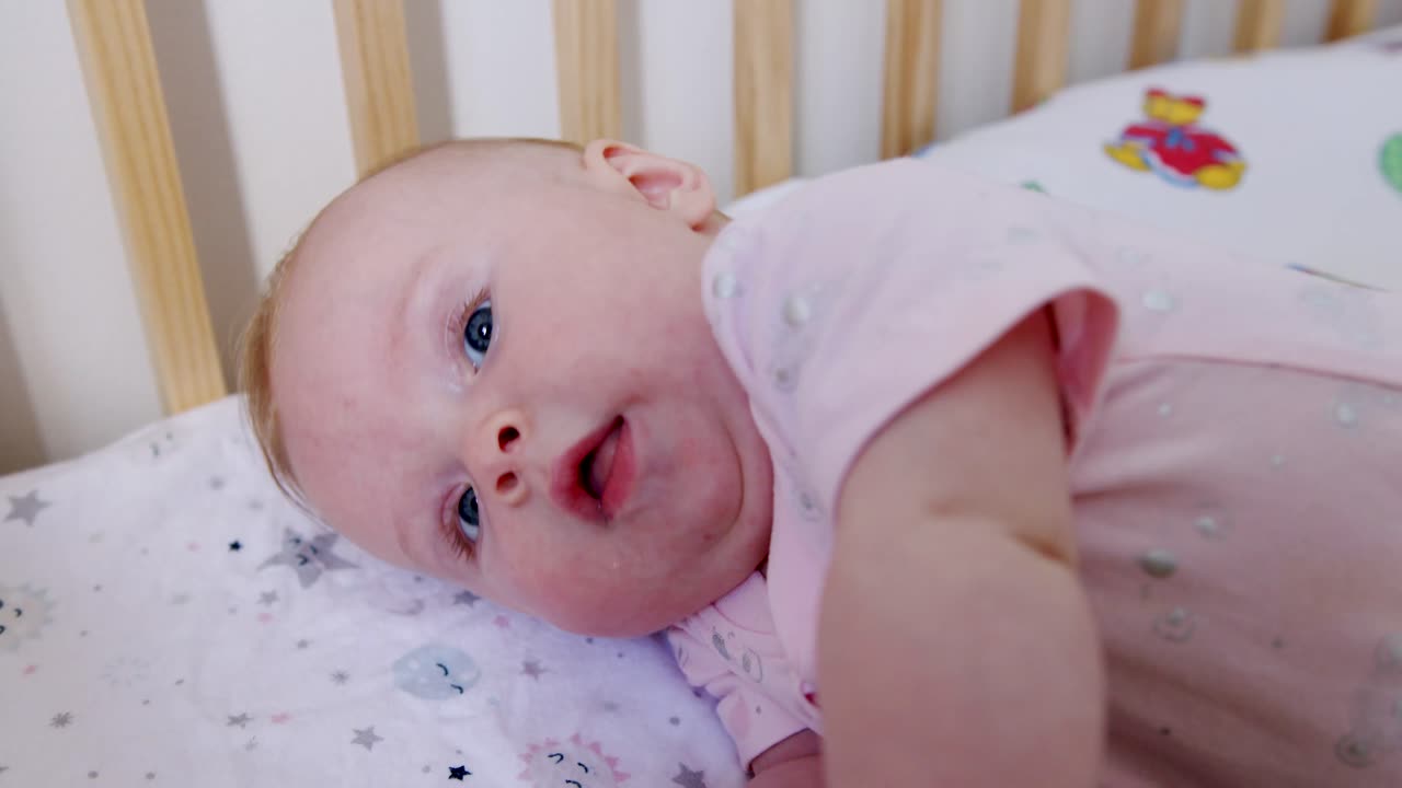 Adorable Baby Playing in Crib