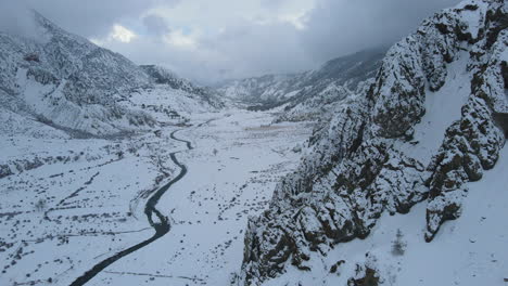 Landscape-of-Annapurna-circuit-Nepal,-drone-shot-Manang-snow-clouds-and-alpine-trees,-hills,-and-mountains-4K