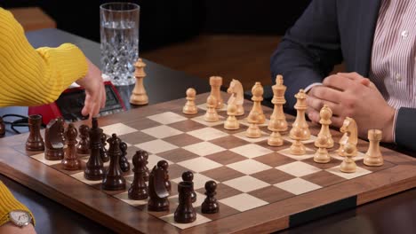 handshake between man and woman before tournament chess game