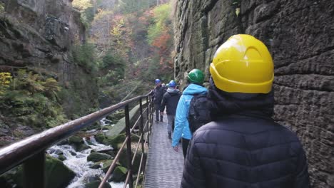 a group of tourists walks through a mountain canyon travel concept a group of tourists walks through a mountain canyon travel concept