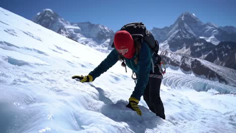 woman climbing a snowy mountain