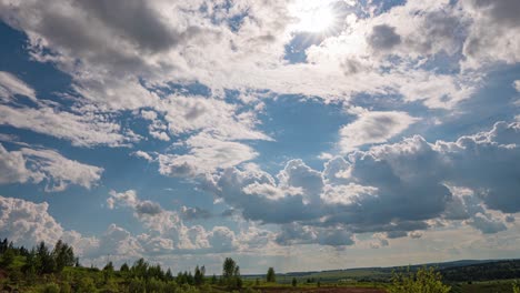 white clouds, clear soft sky, time lapse formating cloudscape in horizon, rainy rolling fast moving, beautiful summer sunny day, colourful weather.