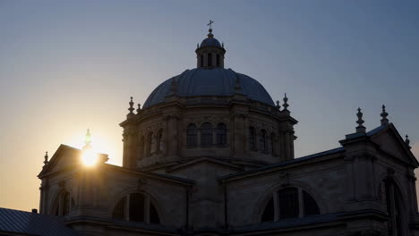 silhouette of a church at sunset