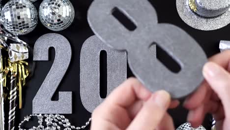 silver numbers of 2018 year on a black background.