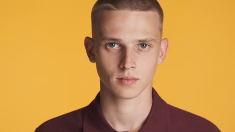 blond young man posing