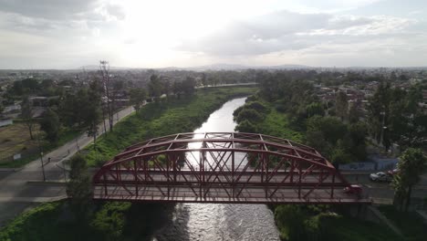 aerial view of twin bridge with traffic at sunset