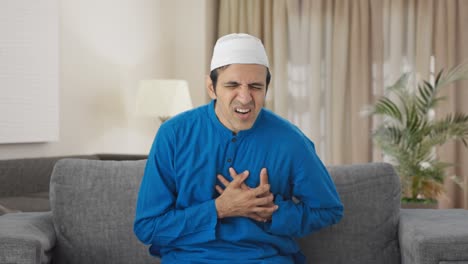 sick muslim man having severe heart attack