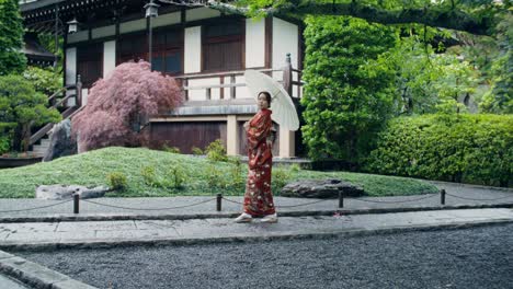 woman in kimono at a japanese temple garden