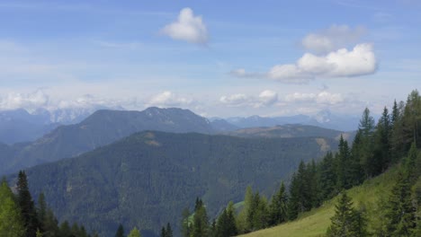layers of mountains and peaks covered with green forest