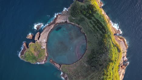 crater of submerged volcano - scenic vila franca islet, top down aerial riser