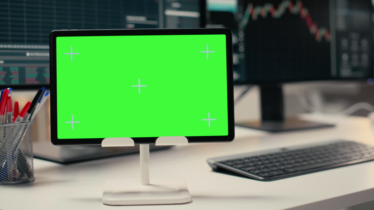 Trading software in prop firm office with graphs on isolated screen tablet