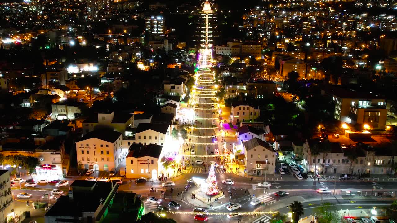 Aerial time lapse of people and cars in downtown Haifa at night, Israel