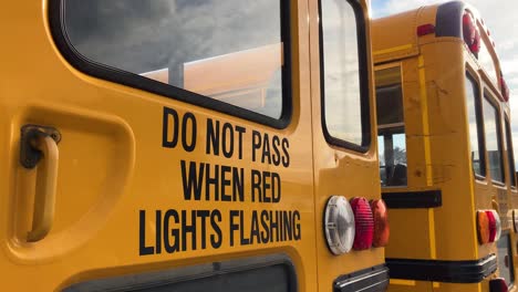 do not pass when red lights flashing caution warning on back of school bus