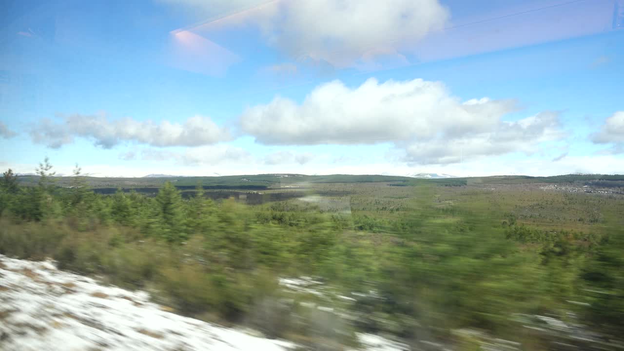 Shooting from the railway carriage, through glass in the movement. Shooting in the movement