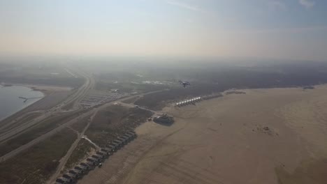 Aerial:-A-drone-flying-at-the-Veerse-dam-with-touristic-beach-houses