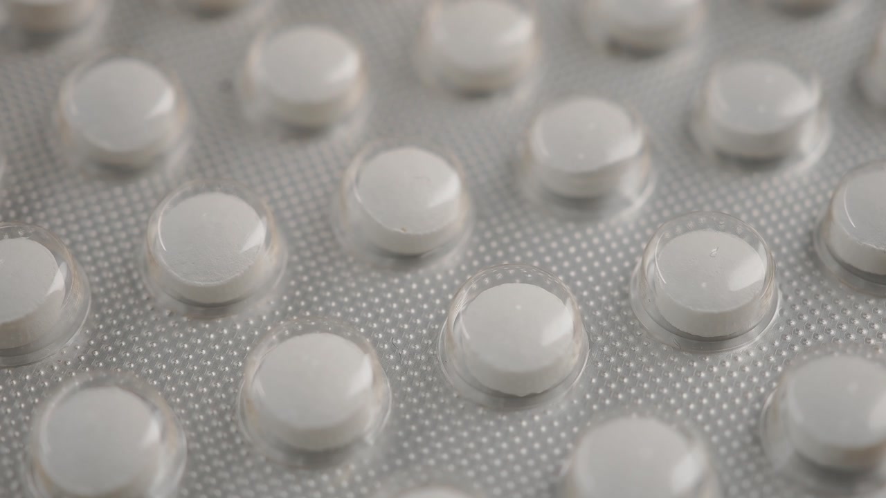 Close-up View of White Pills in a Blister Pack