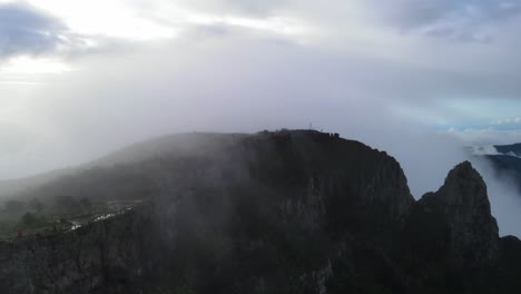 Drone-footage-of-a-mountain-and-crest-on-a-cloudy-day