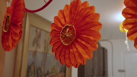 holiday crafts, hanging orange paper flower with dried orange slice