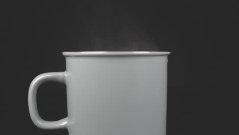 filling cup with hot water with vapour, slow motion 4k