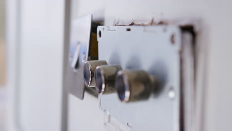 close up of electric light switches and dimmers being fitted