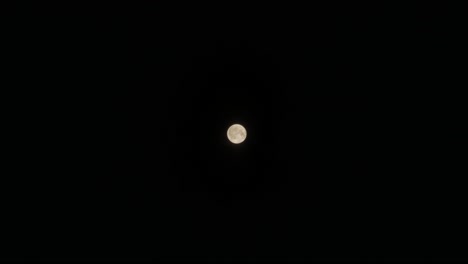 Wide-Shot-of-a-Full-Moon-with-Passing-Cloud