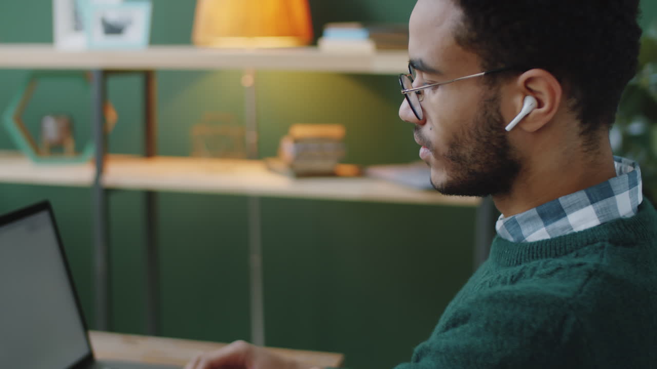 Young Man Working on Laptop