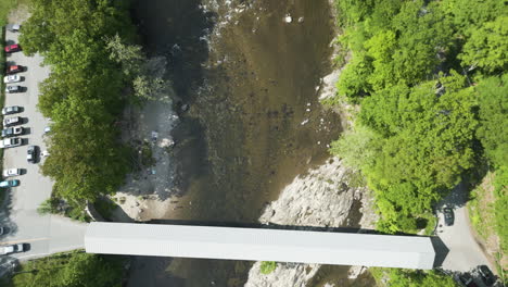 the west dummerston covered bridge in vermont on a sunny day, aerial view