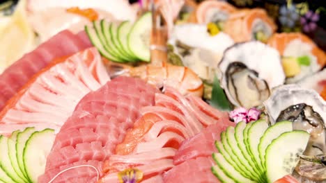 a colorful display of assorted sushi and sashimi