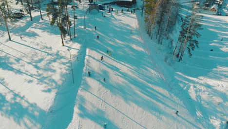 people in winter dressing ski along mountain resort track