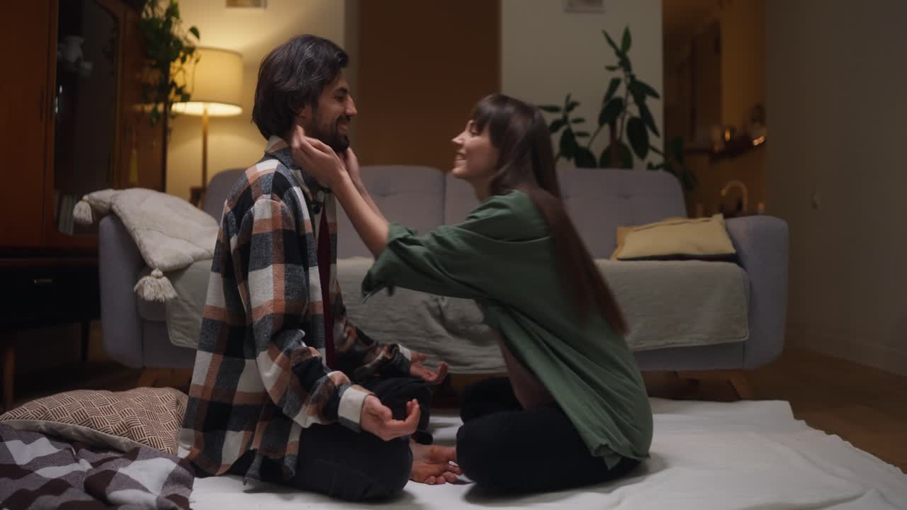 A couple sharing an intimate moment indoors