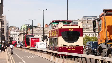 buses and trucks moving on a busy bridge