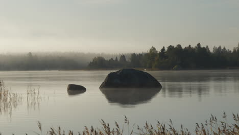 static time lapse of lake fog in early morning, loopable 4k video