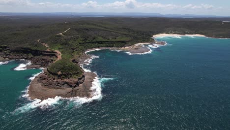 scenic view of wybung head lookout and seascape in frazer park, new south wales, australia - drone shot