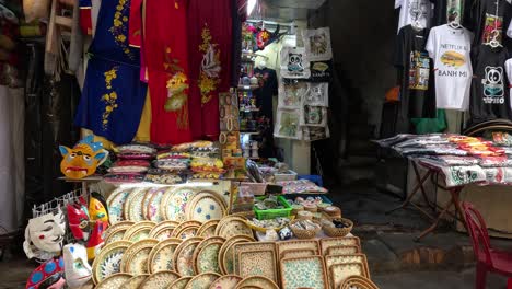 arranging and showcasing products at a market stall