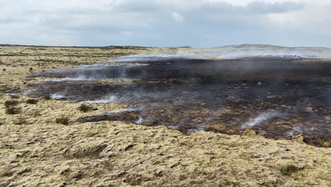 Smoke-rising-from-lava-field-after-active-volcano-eruption