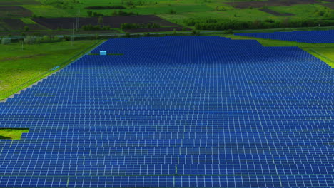 Renewable-power-farm-in-countryside-landscape.-Aerial-view-rows-of-solar-panels
