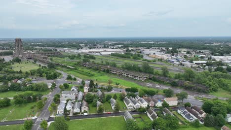 an aerial view of the green city of buffalo, new york with storm clouds in the distance