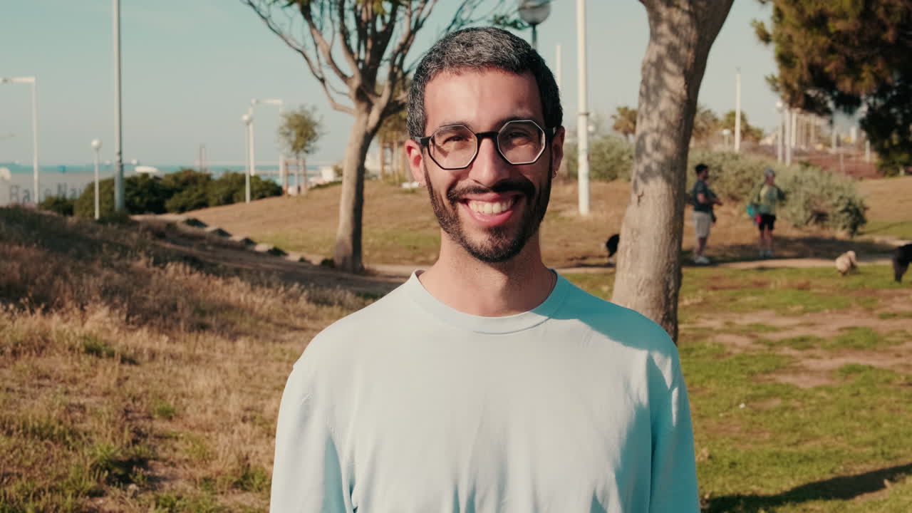 Happy Man Smiling at Picnic in the Park