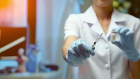 a nurse shows the syringe she will use to a patient receiving a covid vaccine injection