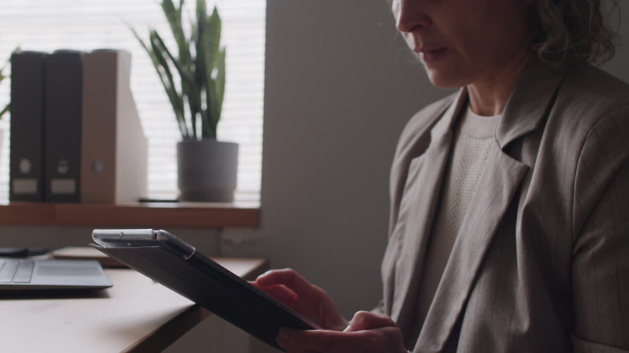 Woman using a tablet in an office