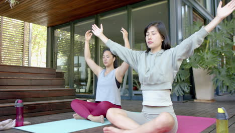 happy asian female friends exercising and spending time in home, slow motion