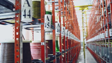 modern cable factory. cable warehouse interior with shelves