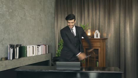 portrait of relax successful middle east business man, ceo person dancing. entertainment leisure fun. people lifestyle at home.