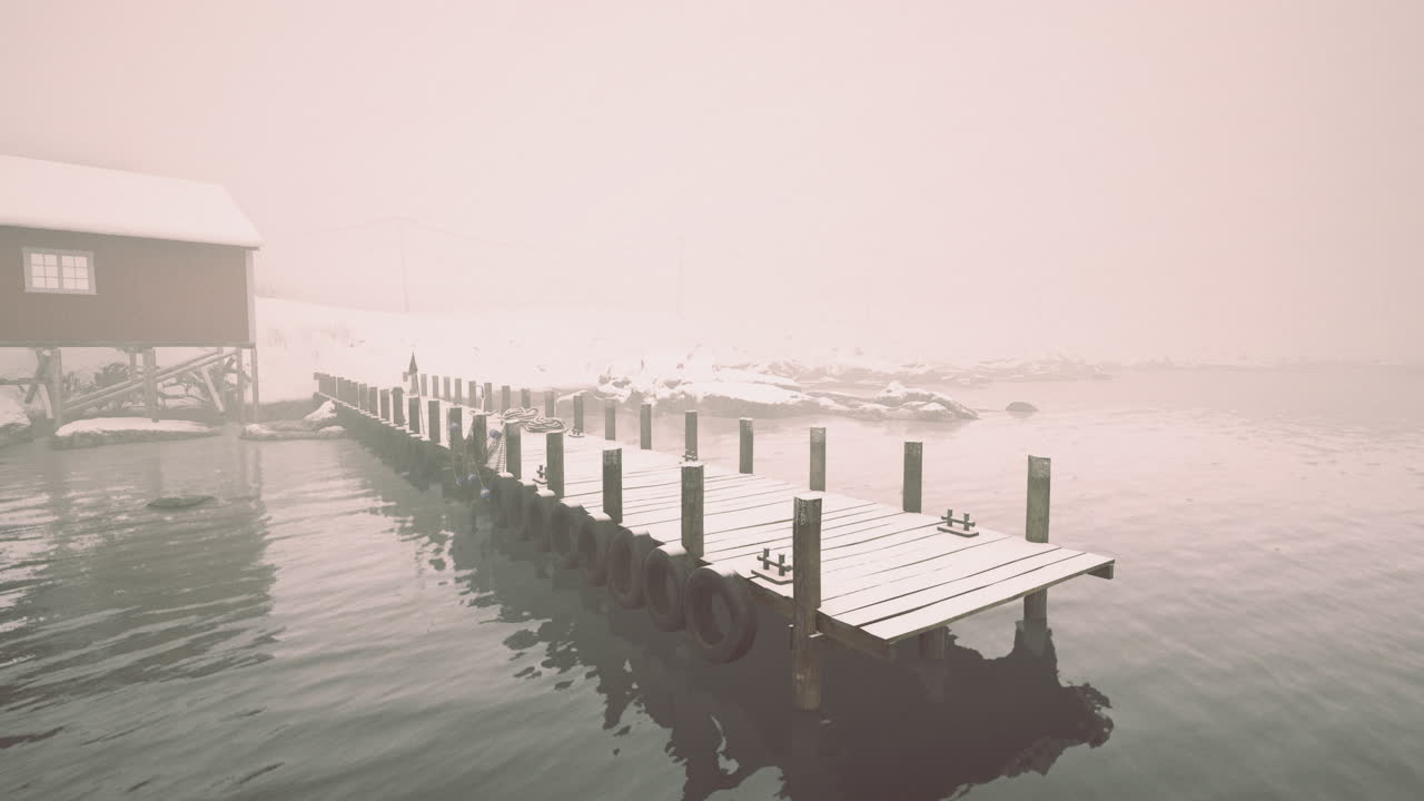Serene wooden pier leading into misty winter waters