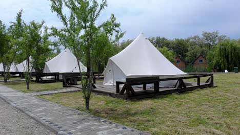 row of glamping tents in a glamping resort