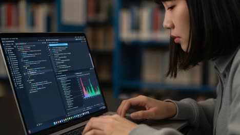 focused programming session: a young individual analyzing data and writing code on a laptop in a study environment with library background